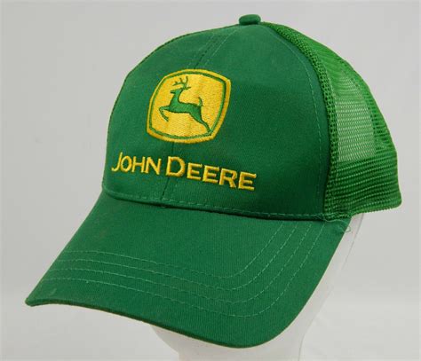 This green cotton blend hat features the iconic John Deere logo on a black patch front and center. . John deere trucker hats